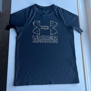 Black short sleeve shirt from Under Armour. This shirt is a size boys large.